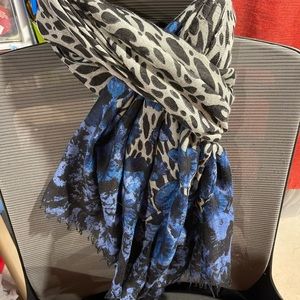 Black& white cheeta print with blue design. 100% polyester.